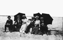 Group under umbrellas